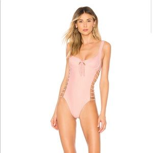 Blush pink striped swimsuit from Revolve/Tularosa